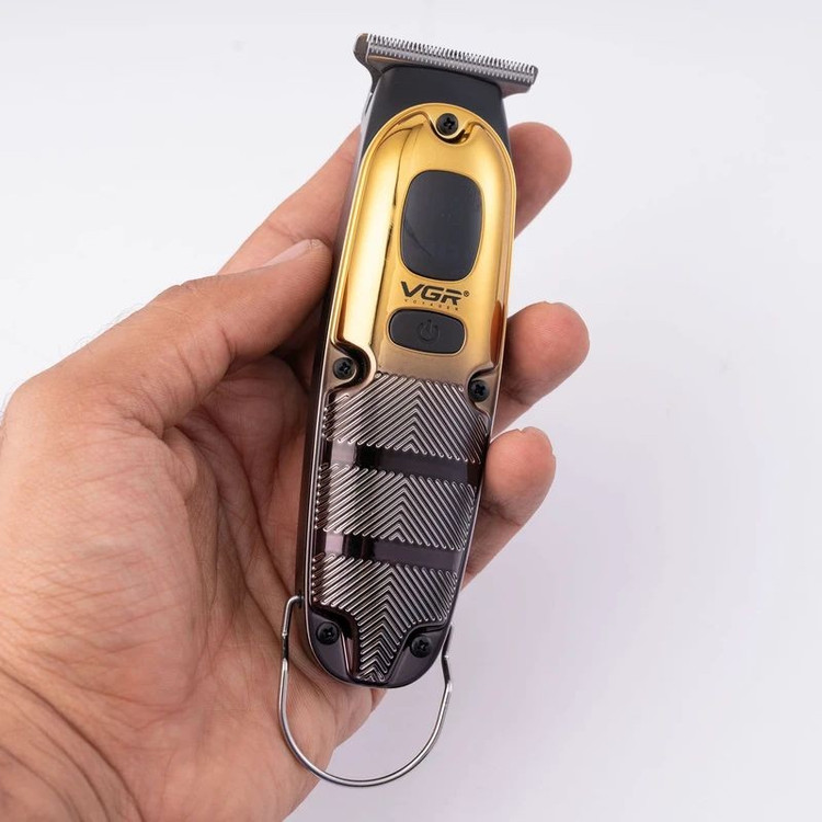 ماشین اصلاح موی صورت وی جی ار مدل V-981 با تیغه استیل ضد زنگ، عملکرد توربو، طراحی ارگونومیک، شارژ سریع 90 دقیقه و است...